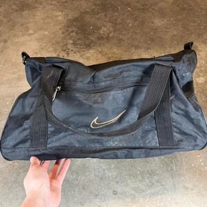 Vintage 90s Nike black duffle bag with gold logo